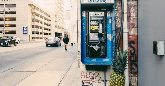 Telephone beside street, illustrating prisons fighting phones to protect revenue