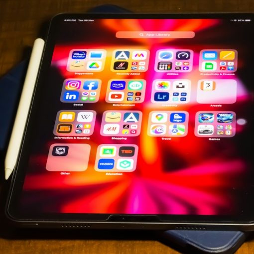 A tablet computer sitting on top of a wooden table, illustrating prison tablet news roundup