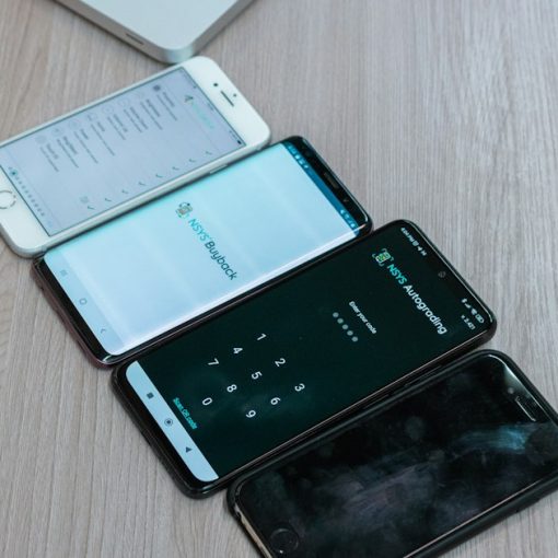 Three cell phones sitting next to each other on a table, illustrating phones confiscated in the Bahamas