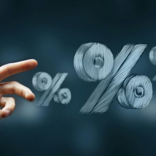 Hand reaching towards floating percentage symbols, illustrating Michigan prison phone rate increase