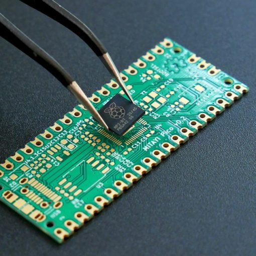 Tweezers placing a small microchip onto a circuit board, illustrating a dropped prisoner RFID trial