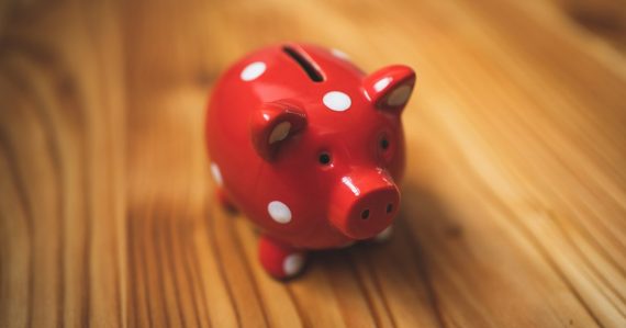 Pink and black ceramic piggy bank, illustrating the cost of underfunding prisons