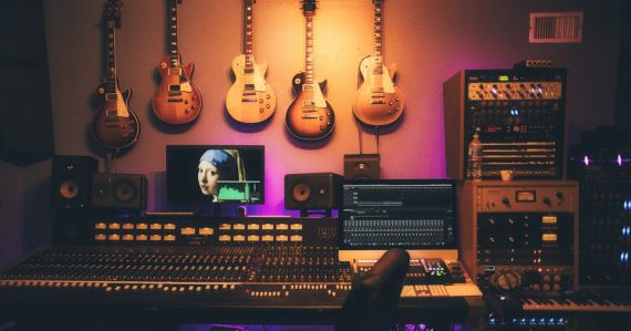 A recording studio with a large mixing console, illustrating evidence from recorded jail calls