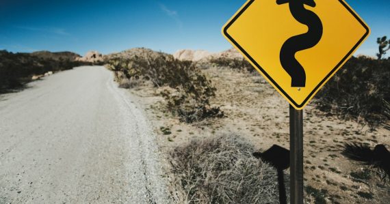 Yellow road sign, illustrating lower call rates aiding rehabilitation