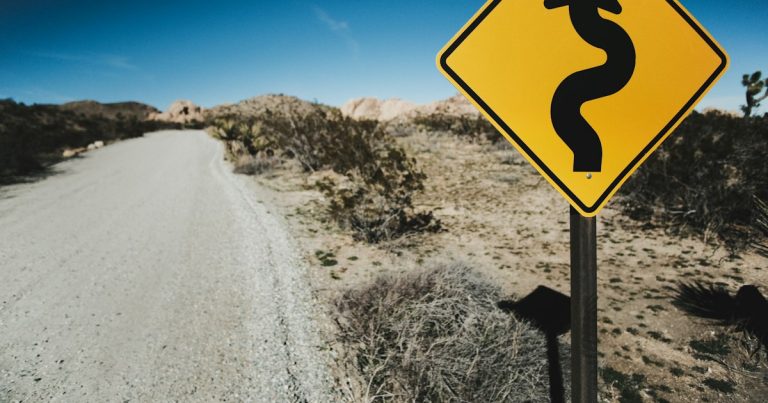 Yellow road sign, illustrating lower call rates aiding rehabilitation
