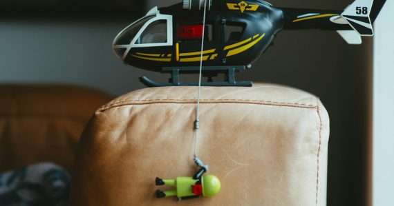 Black and white helicopter toy, illustrating a helicopter smuggling phones