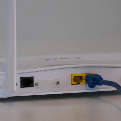 White router on white table, illustrating WiFi risks in prisons