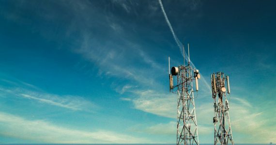 Black metal tower under blue sky, illustrating a Kenyan carrier cutting service to jails