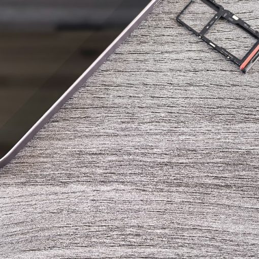 Smartphone with sim card tray removed, illustrating forensics of contraband phones