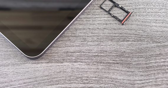 Smartphone with sim card tray removed, illustrating forensics of contraband phones