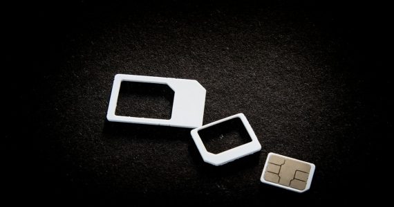 Sim cards and their adaptors are on display, illustrating detecting phones and SIM cards in prison