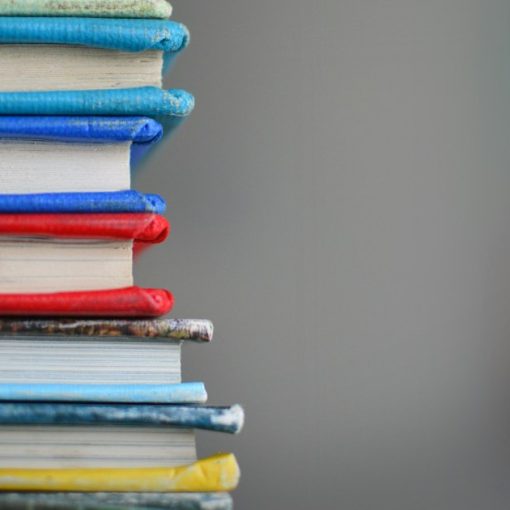 Shallow focus photography of books, illustrating smuggling phones in books in Israel