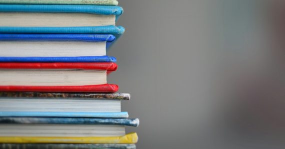 Shallow focus photography of books, illustrating smuggling phones in books in Israel