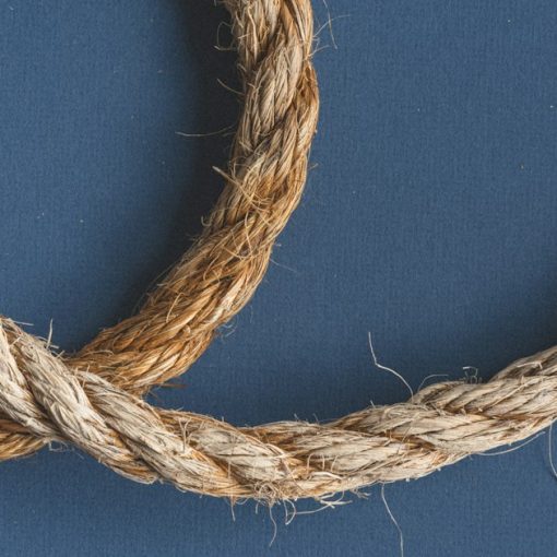 Brown rope on blue textile, illustrating a phone smuggled in with a string
