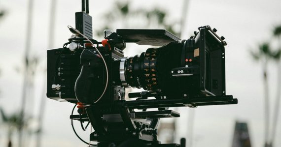 Black professional video camera, illustrating a video series on California prison phones