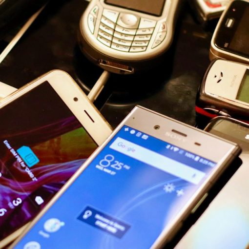 Assorted-color phone lot, illustrating the cost of calling inmates