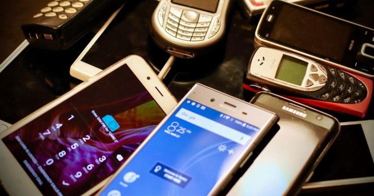 Assorted-color phone lot, illustrating the cost of calling inmates