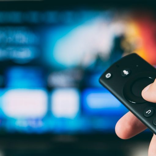 Turned-on flat screen television, illustrating TVs helping prisons manage inmates